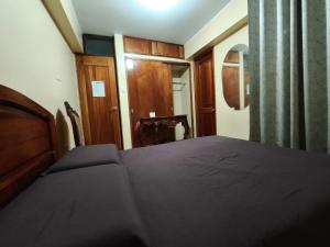 Postel nebo postele na pokoji v ubytování Hostal Real