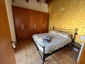 Katil atau katil-katil dalam bilik di Casa Gualtieri