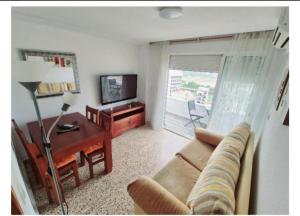 TV a/nebo společenská místnost v ubytování APARTAMENTO VISTAS AL MAR, 11 Planta, 50M PLAYA!!
