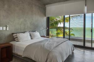 Postel nebo postele na pokoji v ubytování Casa Gonza Holbox
