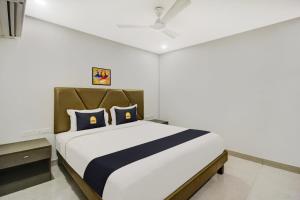 Postel nebo postele na pokoji v ubytování Hotel O D Suites