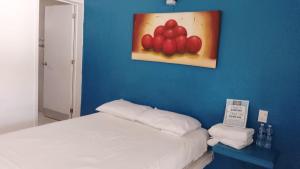 Postel nebo postele na pokoji v ubytování Hotel Costa Esmeralda + 3 fotografie
