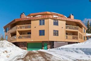 a building with snow in front of it at CozyNest Condo, Beautiful & Comfy 1Bed in Brian Head