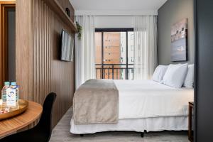 Кровать или кровати в номере Paraíso Paulista Flats by Feel Sampa