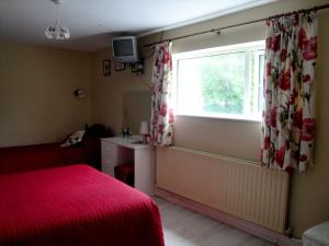 Letto o letti in una camera di Ardrinane House