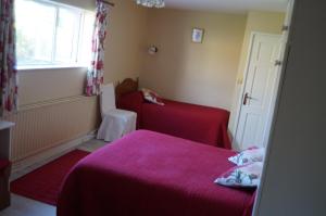 Letto o letti in una camera di Ardrinane House