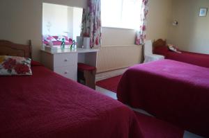 Letto o letti in una camera di Ardrinane House