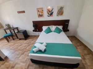 Cama ou camas em um quarto em Eco-Hotel Palma É Coco