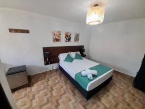 Cama ou camas em um quarto em Eco-Hotel Palma É Coco