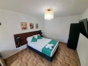 Cama ou camas em um quarto em Eco-Hotel Palma É Coco