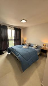 En eller flere senge i et værelse på Guesthouse Luxury