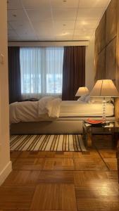 Postel nebo postele na pokoji v ubytování Elegant Studio in the Heart of Monte Carlo