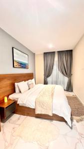 Katil atau katil-katil dalam bilik di Essence Luxury 1 bedroom Suite, Airport-Accra