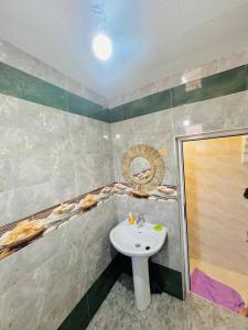 a bathroom with a sink and a shower at Skb Sea House Taghazout in Taghazout +29 photos