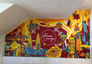 a mural on the wall of a room at Alamis City Kuala Lumpur - Formerly EDC Hotel Kuala Lumpur in Kuala Lumpur