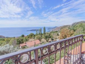 a view of the ocean from the balcony of a house at Holiday Home Danilo in Sveti Stefan