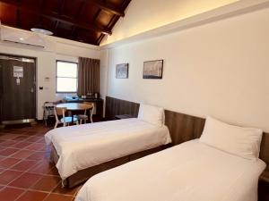 Voodi või voodid majutusasutuse 貝富門旅館 - 澎湖灣行旅 toas