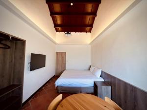 Voodi või voodid majutusasutuse 貝富門旅館 - 澎湖灣行旅 toas