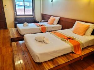 Postel nebo postele na pokoji v ubytování Lotus Paradise Resort - SHA PLUS