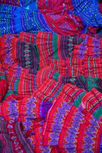 a pile of colorful bangles sitting on a table at Mountain Sprout Homestay in Dồng Văn