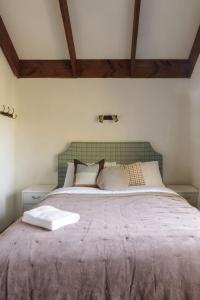 a bedroom with a large bed in a room at Murray's Forest Rest in Lake Tekapo