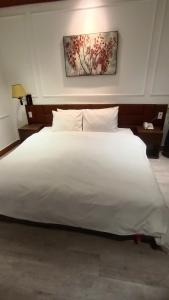 Postel nebo postele na pokoji v ubytování Signature Mithras Hotel25 + 26 fotografií