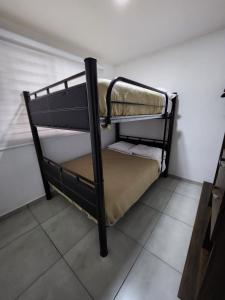 En eller flere senge i et værelse på Nuevo depa con alberca y gym + 24 billeder