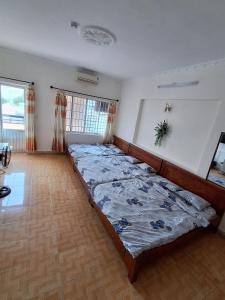 Postel nebo postele na pokoji v ubytování Nhím biển