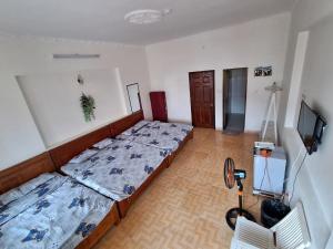 Postel nebo postele na pokoji v ubytování Nhím biển