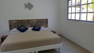 מיטה או מיטות בחדר ב-Casa De Los Peces