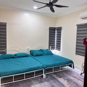 Ένα ή περισσότερα κρεβάτια σε δωμάτιο στο Homestay D'Ammar Private Pool