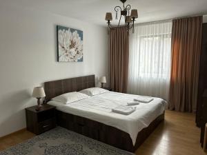 Ένα ή περισσότερα κρεβάτια σε δωμάτιο στο Pensiunea Gradina Mare