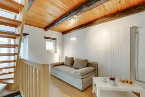 a living room with a couch and a table at Ca dal 1785 Centovalli - Happy Rentals in Intragna