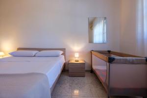 Posteľ alebo postele v izbe v ubytovaní Villa Marinezzi
