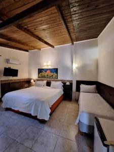 Postel nebo postele na pokoji v ubytování La Locanda + 37 fotografií
