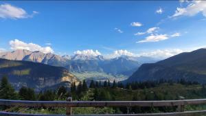 a view of a valley in the mountains at Belalp - schöne Ferienwohnung SOLELUNA in Belalp +3 photos