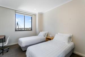 Postel nebo postele na pokoji v ubytování Pyrmont paradise - Anzac bridge view in all rooms BOW66 + 9 fotografií