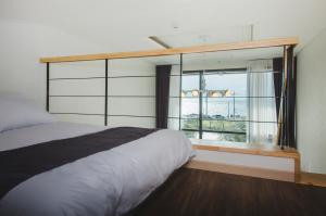 Postel nebo postele na pokoji v ubytování J Raum Resort
