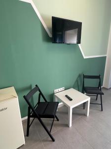 TV a/nebo společenská místnost v ubytování NaLa Nest - small but nice + 2 fotografie