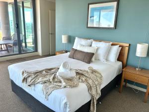 Postel nebo postele na pokoji v ubytování Twin Pines Unit 701