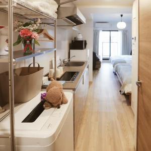 Postel nebo postele na pokoji v ubytování DL Shinsaibashi