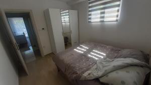 Apartman EXIT-TVRĐAVA客房内的一张或多张床位