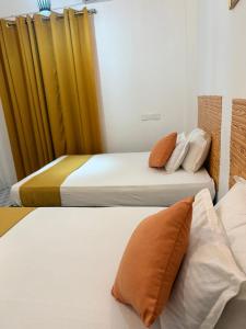 Postel nebo postele na pokoji v ubytování Thambara Resort