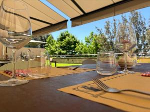 a table with wine glasses and napkins on it at Palazzo Contelori in Terni