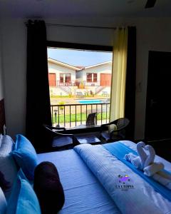 Postel nebo postele na pokoji v ubytování La Utopia Resort