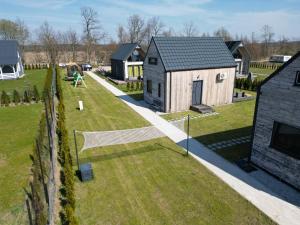 an aerial view of a house with a yard at Baltic Barns Berg in Wytowno