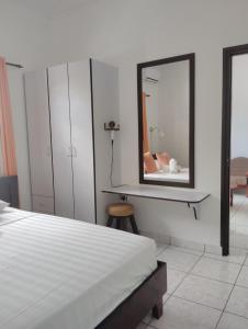 Postel nebo postele na pokoji v ubytování Roche Kerlan Apartments
