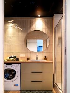 a kitchen with a sink and a washing machine at MomUla's Apartment Pino Sobieszewo Gdańsk in Gdańsk +10 photos