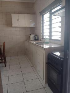 Kuchyň nebo kuchyňský kout v ubytování Roche Kerlan Apartments