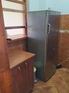 a small bathroom with a shower and a sink at Sea View in Tivat